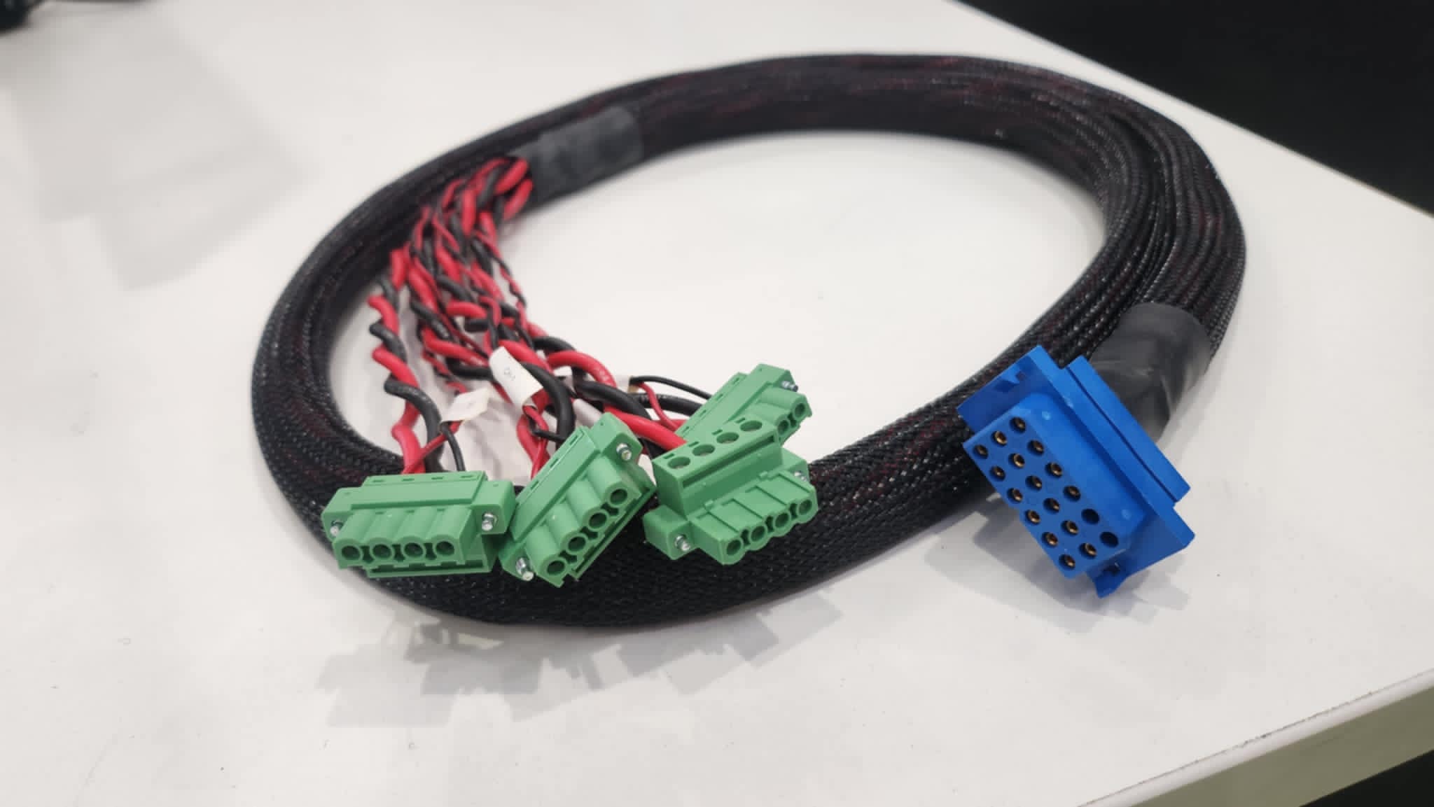 Custom control cable assembly with multiple green and blue connectors, highlighting Control Cables Australia’s role in automotive and industrial wiring solutions.