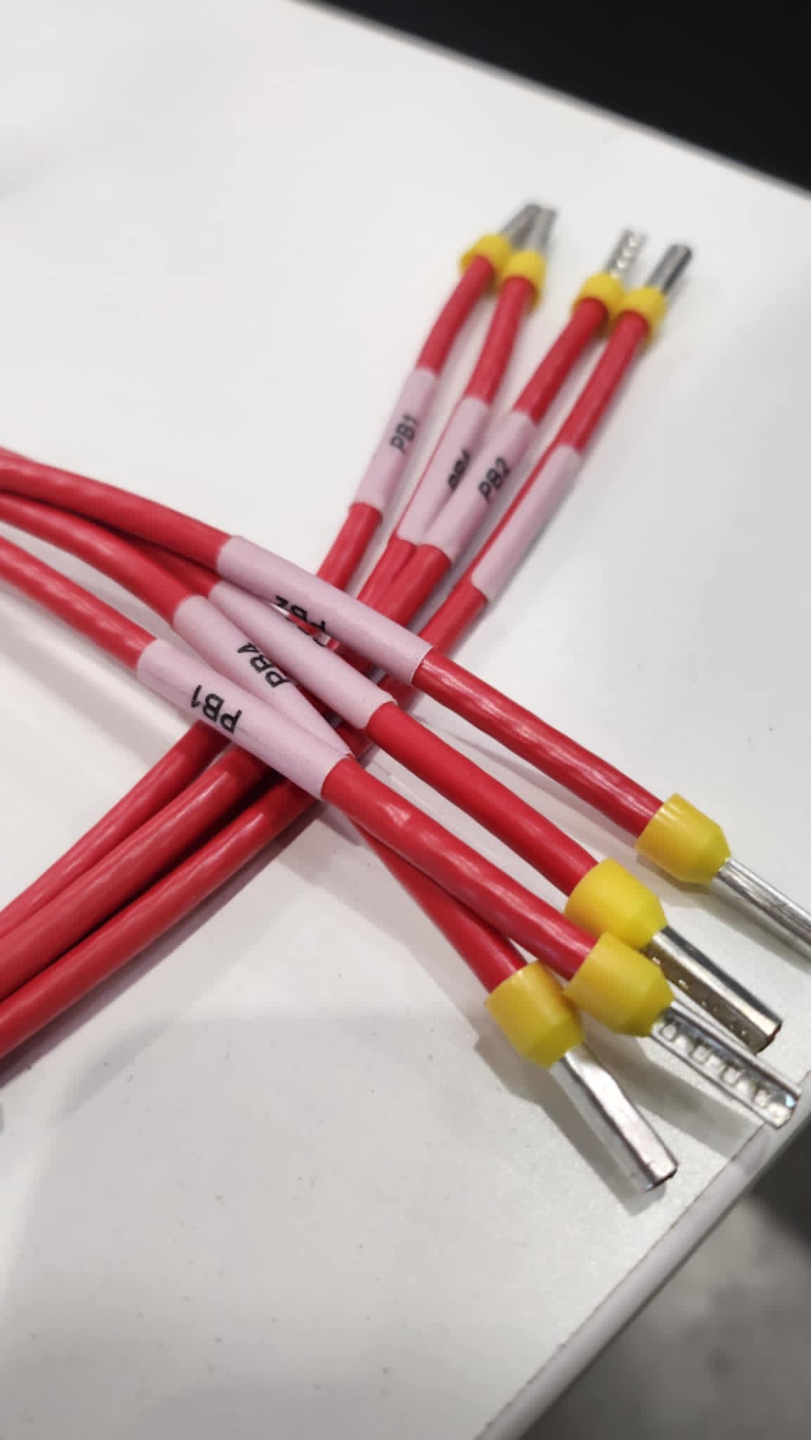 Red labelled wiring set with yellow terminals, demonstrating Control Cables Australia’s precision cable manufacturing for automotive and industry requirements.